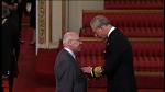 Image: Councillor Baxter collects his MBE